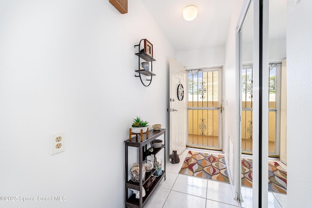 1410 Huntington Ln Unit 1204, Rockledge, FL 32955 - doorway with light tile patterned flooring