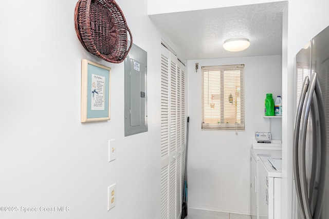 1410 Huntington Ln Unit 1204, Rockledge, FL 32955 - washroom with a textured ceiling, electric panel, independent washer and dryer, and baseboards