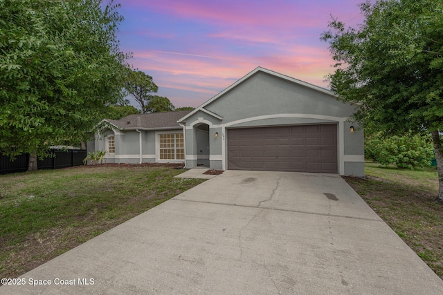 1094 Locust Ave NW, Palm Bay, FL 32907 - ranch-style home with stucco siding, a garage, and concrete driveway