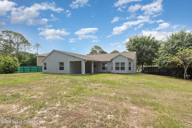1094 Locust Ave NW, Palm Bay, FL 32907 - rear view of property with stucco siding