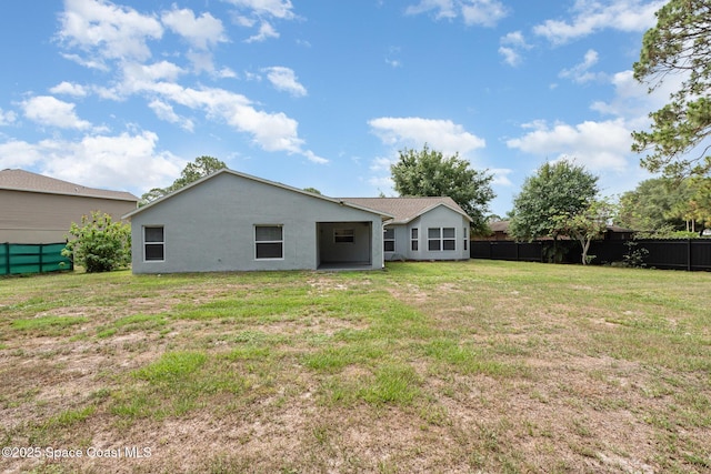 1094 Locust Ave NW, Palm Bay, FL 32907 - back of house featuring stucco siding