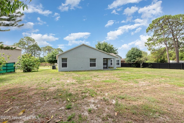 1094 Locust Ave NW, Palm Bay, FL 32907 - back of property with stucco siding and central AC unit