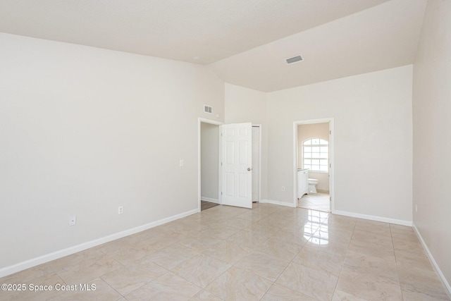 1094 Locust Ave NW, Palm Bay, FL 32907 - spare room with baseboards and high vaulted ceiling