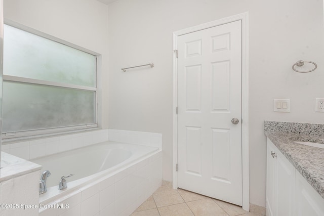 1094 Locust Ave NW, Palm Bay, FL 32907 - full bathroom with a garden tub, vanity, and tile patterned flooring