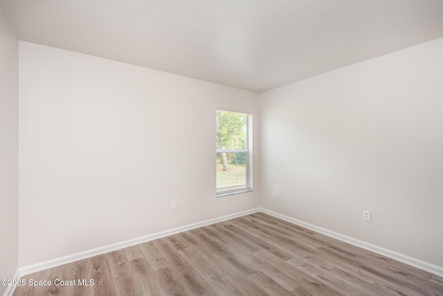 1094 Locust Ave NW, Palm Bay, FL 32907 - empty room featuring light wood-type flooring and baseboards
