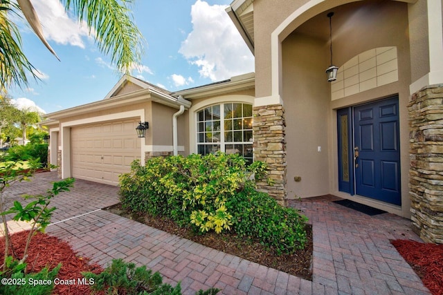 294 Brandy Creek Cir SE, Palm Bay, FL 32909 - property entrance featuring stone siding, stucco siding, and a garage