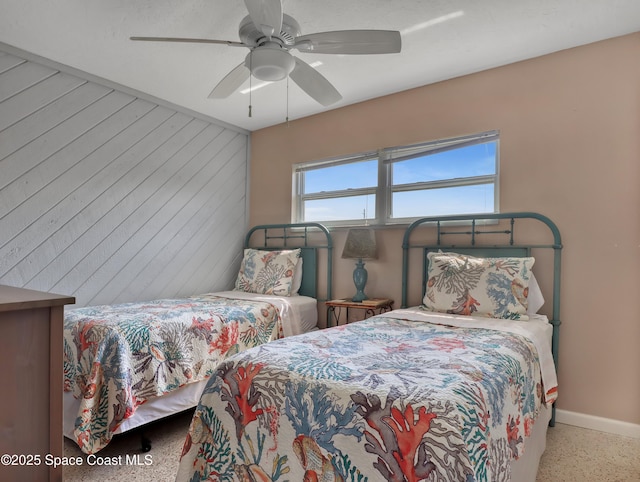 3150 N Atlantic Ave Unit 4-990, Cocoa Beach, FL 32931 - bedroom featuring baseboards, a ceiling fan, and wood walls