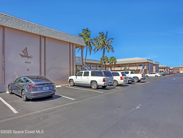 3150 N Atlantic Ave Unit 4-990, Cocoa Beach, FL 32931 - view of uncovered parking lot