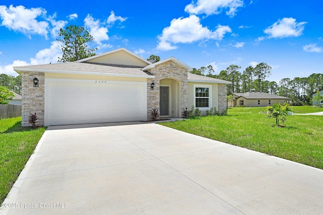 2597 Galiano Ave, Palm Bay, FL 32908 - view of front of house featuring stone siding, concrete driveway, a front yard, and a garage