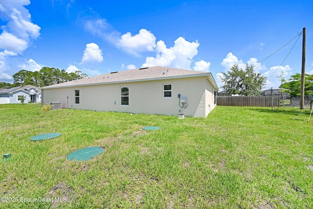 2597 Galiano Ave, Palm Bay, FL 32908 - rear view of property featuring stucco siding and cooling unit