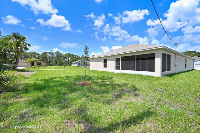 2597 Galiano Ave, Palm Bay, FL 32908 - view of green lawn featuring a sunroom