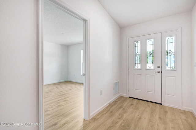 2597 Galiano Ave, Palm Bay, FL 32908 - entryway featuring light wood-style floors and baseboards