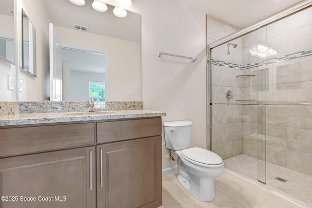 2597 Galiano Ave, Palm Bay, FL 32908 - full bathroom with toilet, a shower stall, tile patterned floors, and vanity