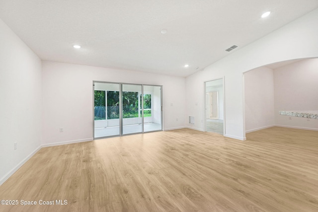 2597 Galiano Ave, Palm Bay, FL 32908 - spare room with light wood-style flooring, recessed lighting, baseboards, and arched walkways
