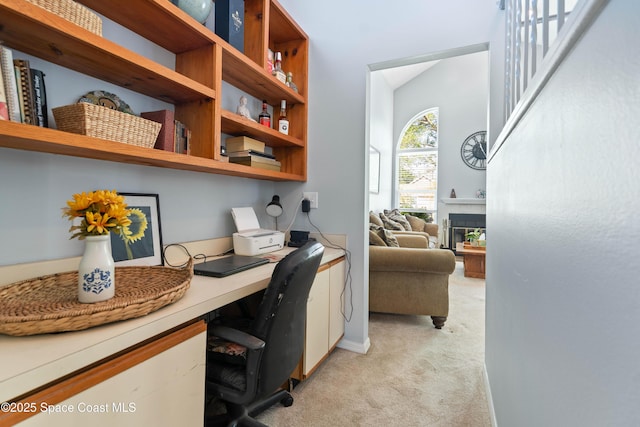 1250 York Cir, Melbourne, FL 32904 - office area with built in study area, light carpet, and a tile fireplace