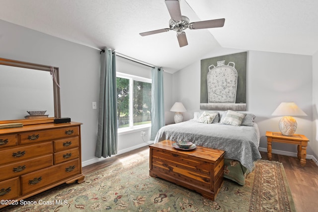 1250 York Cir, Melbourne, FL 32904 - bedroom with baseboards, wood finished floors, vaulted ceiling, and ceiling fan