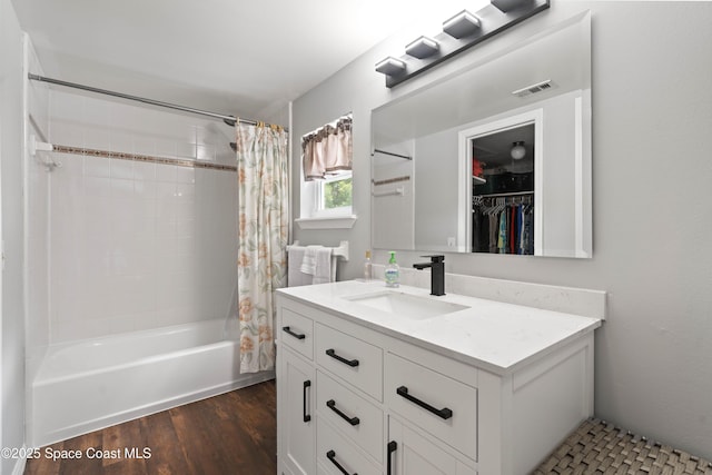 1250 York Cir, Melbourne, FL 32904 - bathroom featuring vanity, shower / tub combo with curtain, and wood finished floors
