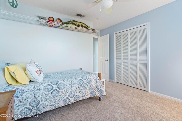 1250 York Cir, Melbourne, FL 32904 - bedroom with carpet flooring, a closet, ceiling fan, and baseboards