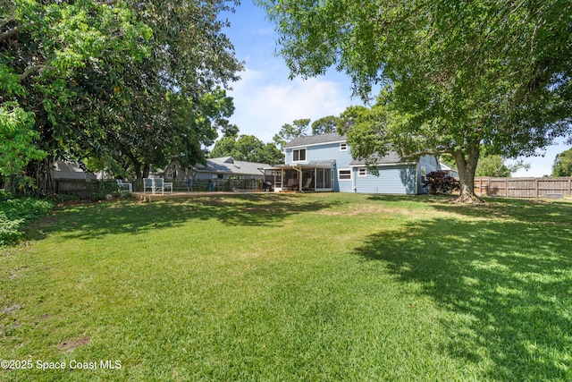 1250 York Cir, Melbourne, FL 32904 - view of yard with a sunroom