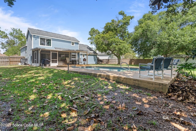 1250 York Cir, Melbourne, FL 32904 - back of house featuring a sunroom and a patio