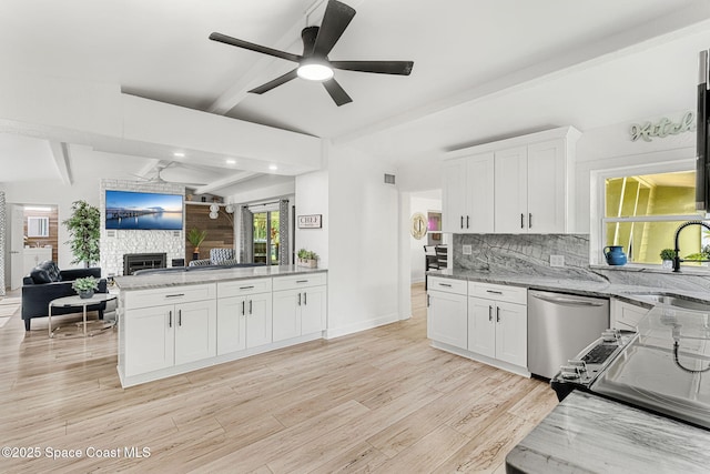 996 S Wickham Rd, West Melbourne, FL 32904 - kitchen with stainless steel appliances, a sink, open floor plan, a fireplace, and ceiling fan