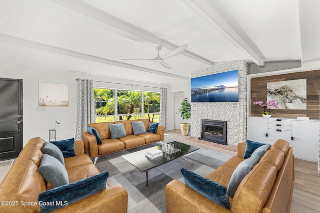 996 S Wickham Rd, West Melbourne, FL 32904 - living room featuring ceiling fan, wood finished floors, beamed ceiling, and a fireplace