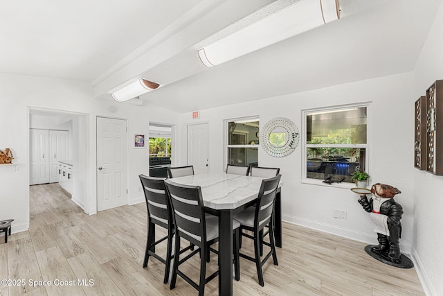 996 S Wickham Rd, West Melbourne, FL 32904 - dining area featuring baseboards, light wood-style floors, and lofted ceiling