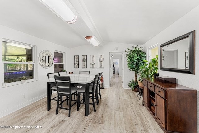 996 S Wickham Rd, West Melbourne, FL 32904 - dining room featuring light wood-style floors and baseboards