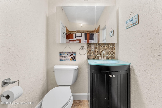 996 S Wickham Rd, West Melbourne, FL 32904 - full bathroom with vanity, toilet, and a textured wall