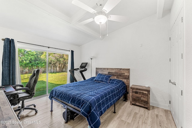 996 S Wickham Rd, West Melbourne, FL 32904 - bedroom with beam ceiling, access to exterior, wood finished floors, an office area, and a ceiling fan
