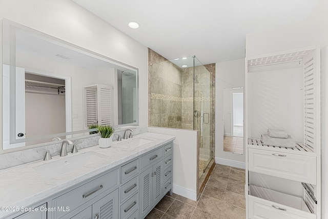 520 Bahama Dr, Indian Harbour Beach, FL 32937 - bathroom with a shower stall, double vanity, a closet, and tile patterned floors
