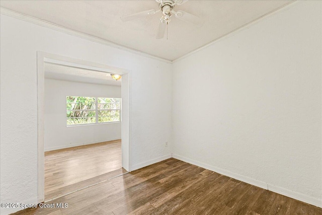 2835 Sunset Rd, Melbourne, FL 32904 - unfurnished room featuring crown molding, wood finished floors, ceiling fan, and baseboards