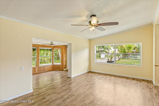 2835 Sunset Rd, Melbourne, FL 32904 - spare room featuring wood finished floors, healthy amount of natural light, crown molding, a textured ceiling, and ceiling fan