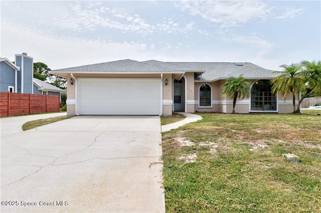 749 Tulip Dr, Sebastian, FL 32958 - view of front of house with driveway, stucco siding, and an attached garage