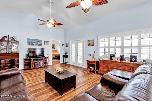 749 Tulip Dr, Sebastian, FL 32958 - living area with ceiling fan, high vaulted ceiling, and light wood-style flooring