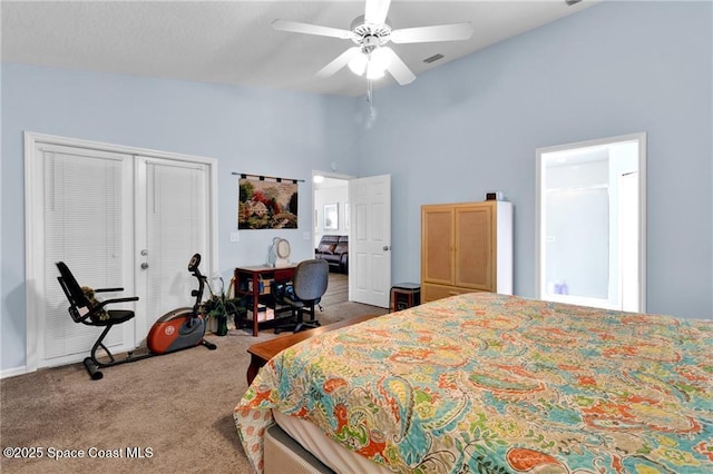 749 Tulip Dr, Sebastian, FL 32958 - carpeted bedroom with high vaulted ceiling and ceiling fan