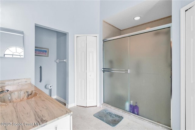 749 Tulip Dr, Sebastian, FL 32958 - bathroom with a shower stall, vanity, baseboards, and a closet