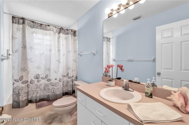 749 Tulip Dr, Sebastian, FL 32958 - bathroom featuring vanity, toilet, and shower / tub combo