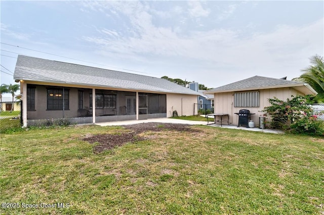 749 Tulip Dr, Sebastian, FL 32958 - back of property with a sunroom and a shingled roof