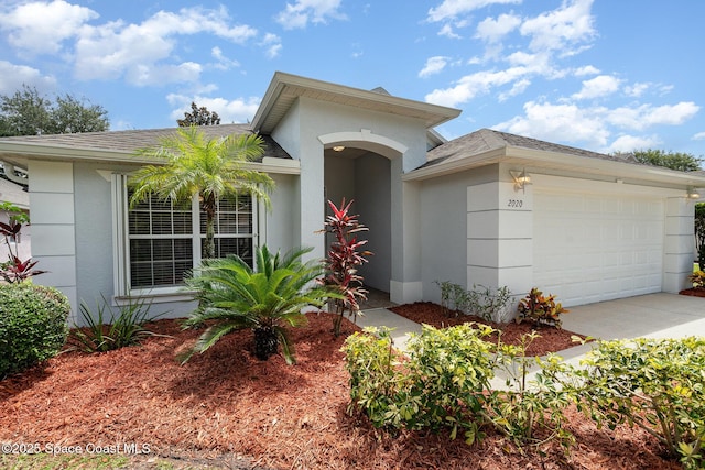 2020 Twelve Oaks Dr SE, Palm Bay, FL 32909 - ranch-style house featuring a garage, stucco siding, concrete driveway, and a shingled roof