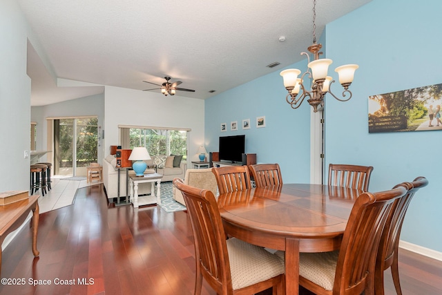 2020 Twelve Oaks Dr SE, Palm Bay, FL 32909 - dining area with wood finished floors, a ceiling fan, a chandelier, and baseboards