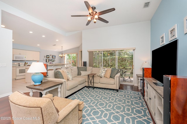 2020 Twelve Oaks Dr SE, Palm Bay, FL 32909 - living area featuring a ceiling fan, a chandelier, recessed lighting, lofted ceiling, and light wood-style floors
