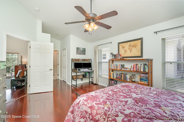 2020 Twelve Oaks Dr SE, Palm Bay, FL 32909 - bedroom featuring wood finished floors, multiple windows, ceiling fan, baseboards, and high vaulted ceiling