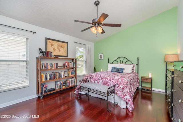 2020 Twelve Oaks Dr SE, Palm Bay, FL 32909 - bedroom featuring wood finished floors, lofted ceiling, baseboards, ceiling fan, and a textured ceiling