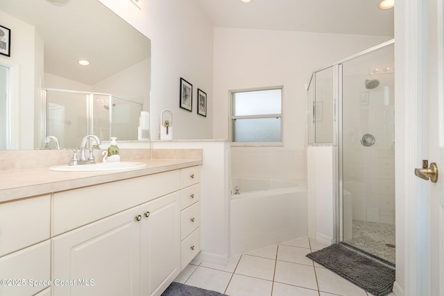 2020 Twelve Oaks Dr SE, Palm Bay, FL 32909 - bathroom featuring tile patterned flooring, a shower stall, vanity, a garden tub, and recessed lighting