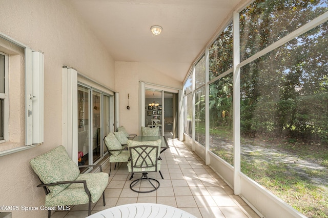2020 Twelve Oaks Dr SE, Palm Bay, FL 32909 - sunroom / solarium featuring vaulted ceiling and a chandelier