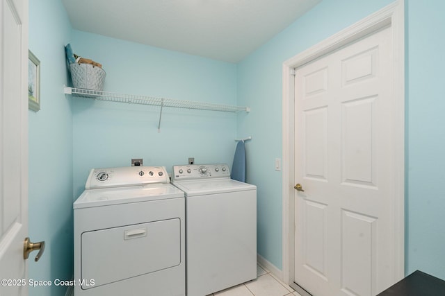 2020 Twelve Oaks Dr SE, Palm Bay, FL 32909 - washroom with washer and dryer, light tile patterned flooring, and baseboards