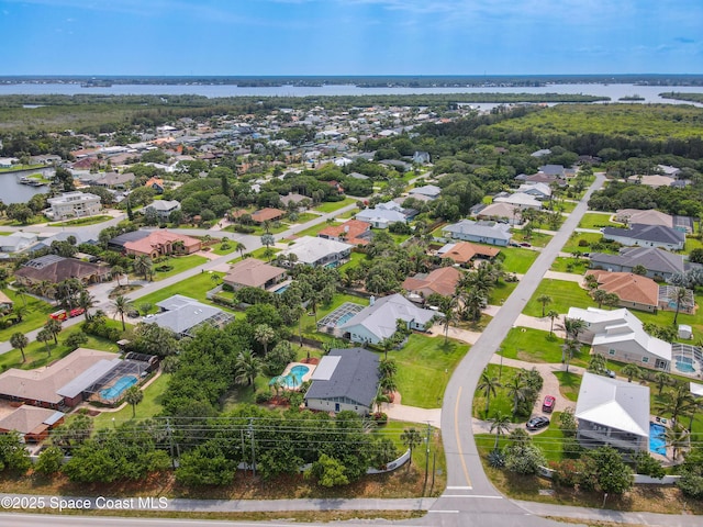 201 Woody Cir, Melbourne Beach, FL 32951 - aerial overview of property's location featuring nearby suburban area and a large body of water