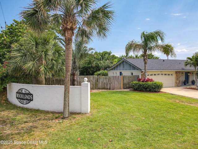 201 Woody Cir, Melbourne Beach, FL 32951 - view of yard with driveway and an attached garage