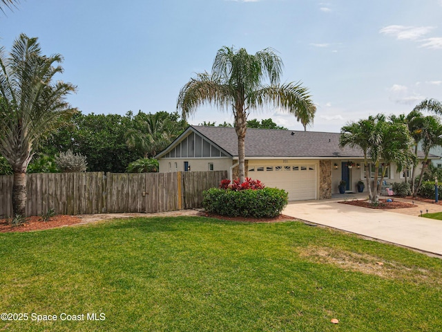 201 Woody Cir, Melbourne Beach, FL 32951 - view of front facade with driveway, a garage, and a shingled roof